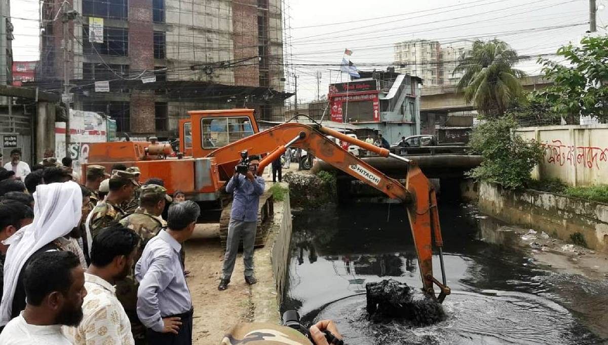 The re-excavation work of a canal in Chattogram city is underway. Photo: UNB