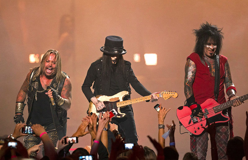 Motley Crue band members Vince Neil (L), Mick Mars (C), and Nikki Sixx perform during the 2014 iHeartRadio Music Festival in Las Vegas, Nevada on 19 September 2014. Photo: Reuters