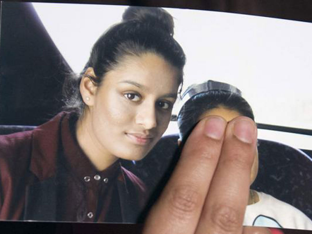 In this file photo taken on 22 February 2015 Renu Begum, eldest sister of missing British girl Shamima Begum, holds a picture of her sister while being interviewed by the media in central London. Photo: AFP