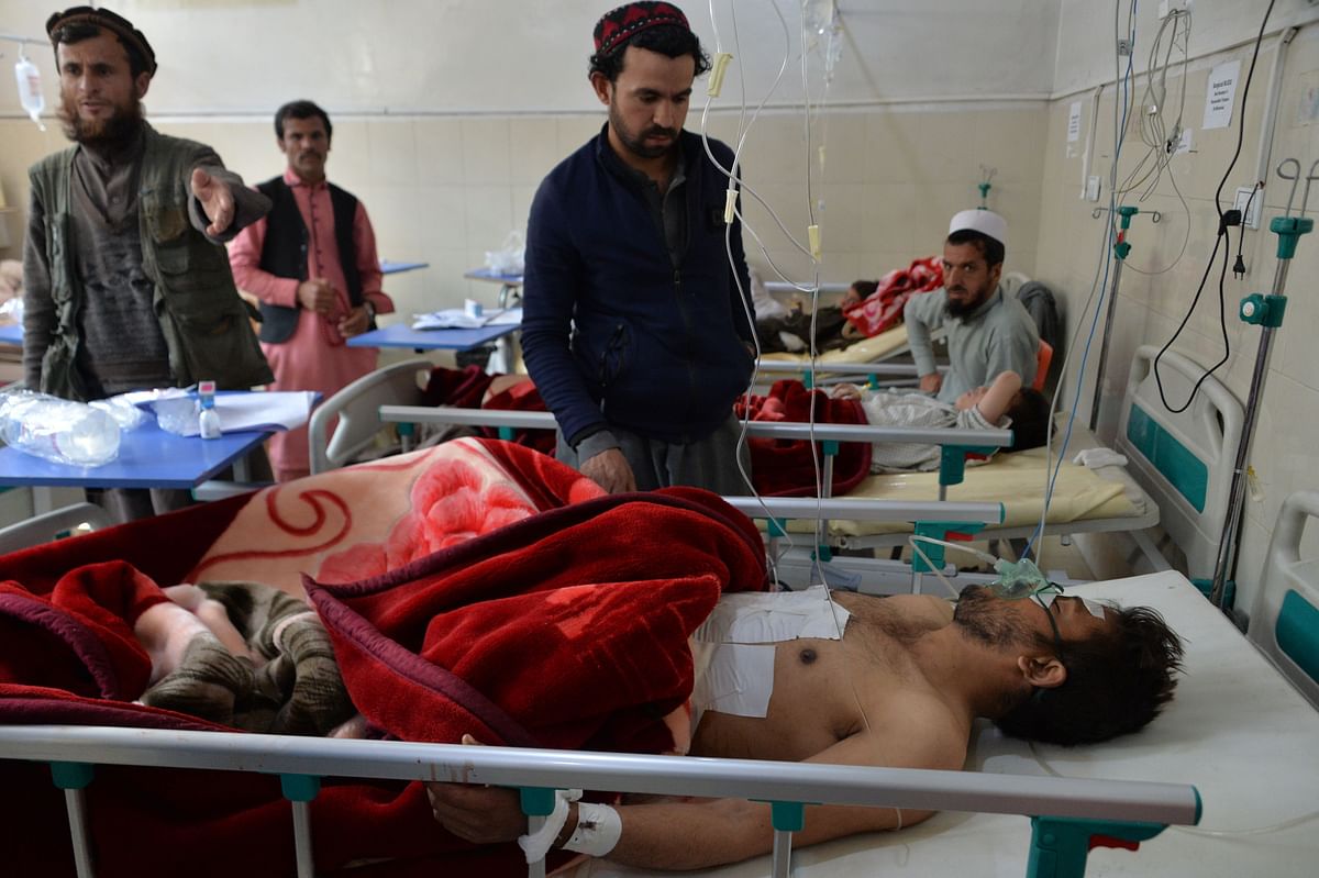 Afghan victims receive medical treatment at a hospital following a suicide attack on a private construction company in Jalalabad on 6 March. Photo: AFP