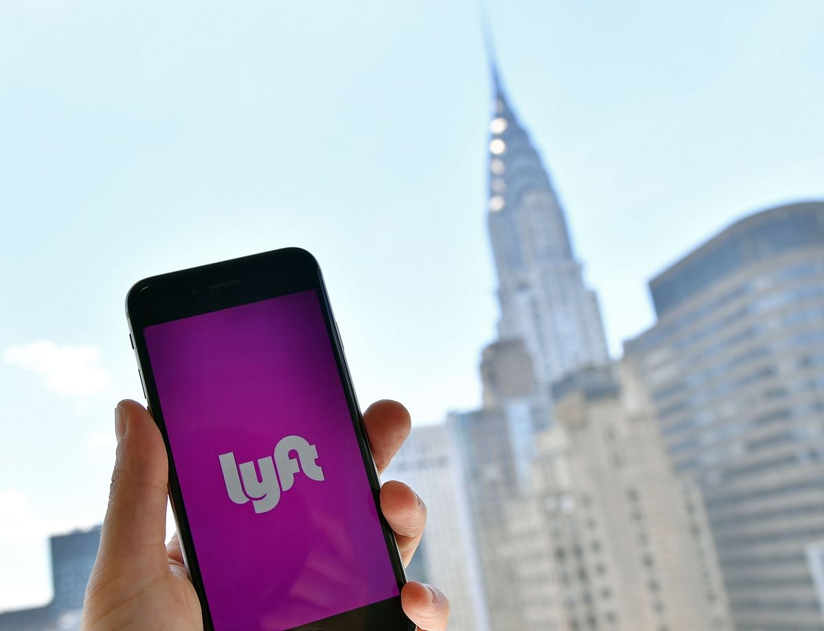 In this file photo taken on 29 June 2018, the Lyft transport application is seen on a smartphone in New York City. Photo: AFP