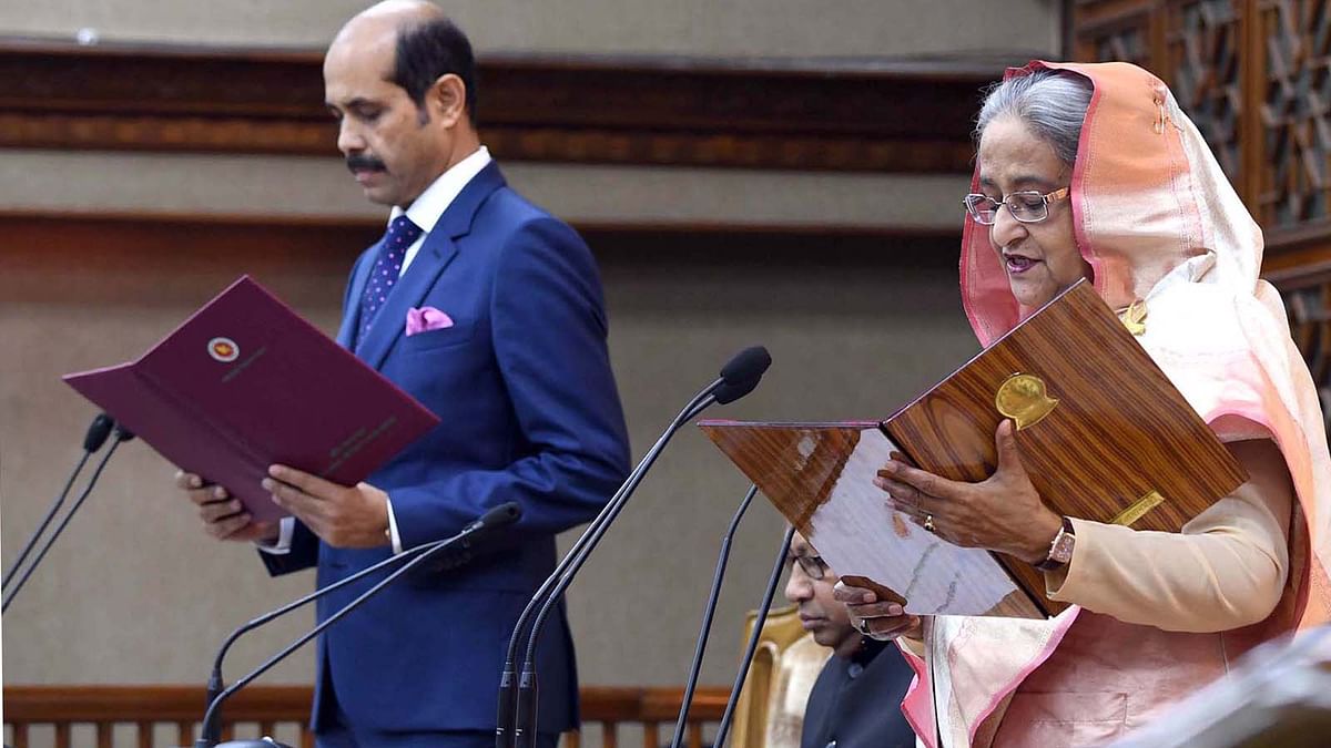 Prime minister Sheikh Hasina administers the oath of Dhaka North City Corporation mayor Md Atiqul Islam at a ceremony at Shapla Hall of her office (PMO) in Dhaka on 7 March 2019. Photo: PID