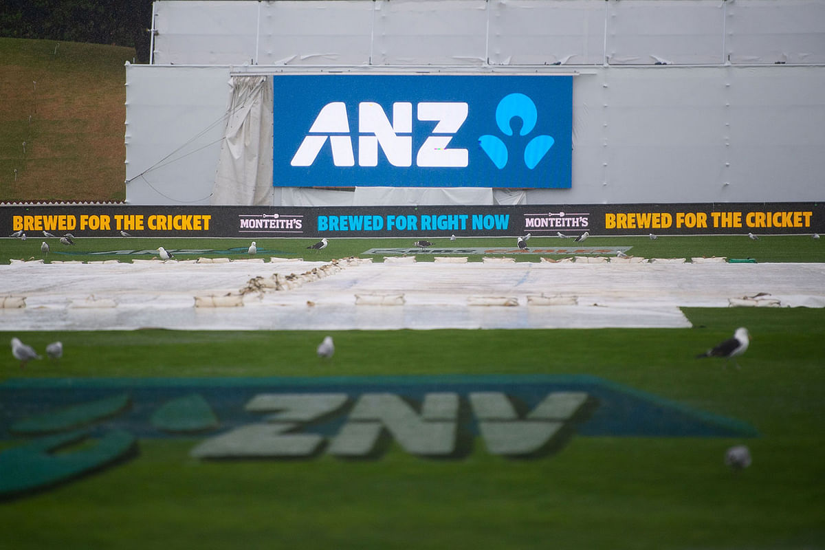 The covers sit on the field as rain causes a delay in the start of the test match during day one of the 2nd Test cricket match between New Zealand and Bangladesh at the Basin Reserve in Wellington on 8 March 2018. Photo: AFP