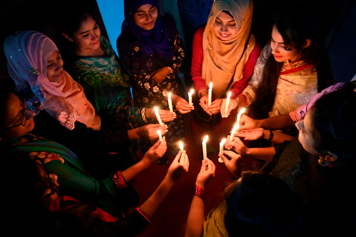 Bangladeshi women attend a candle light vigil to mark International Women`s Day in Dhaka, late on 7 March, 2019. Photo: AFP