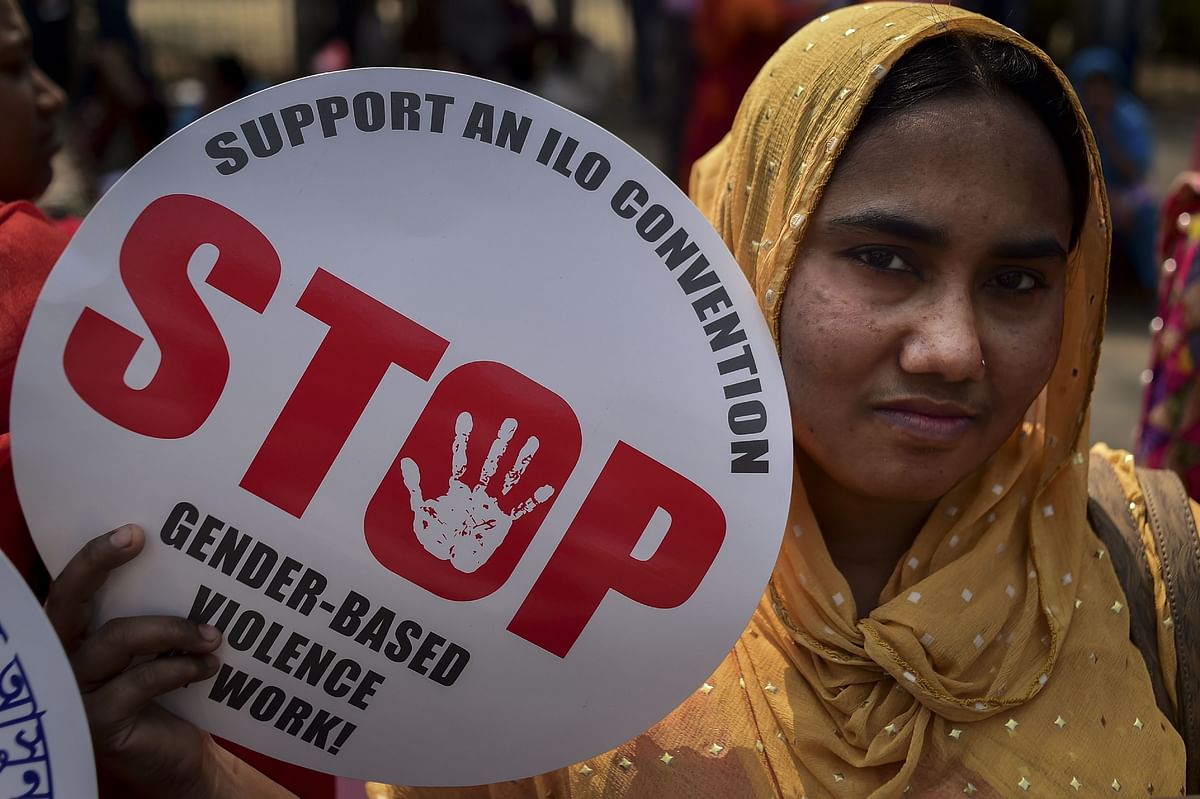 A Bangladeshi woman holds a placard as she takes part in a rally to mark International Women`s Day in Dhaka on 8 March, 2019. Photo: AFP
