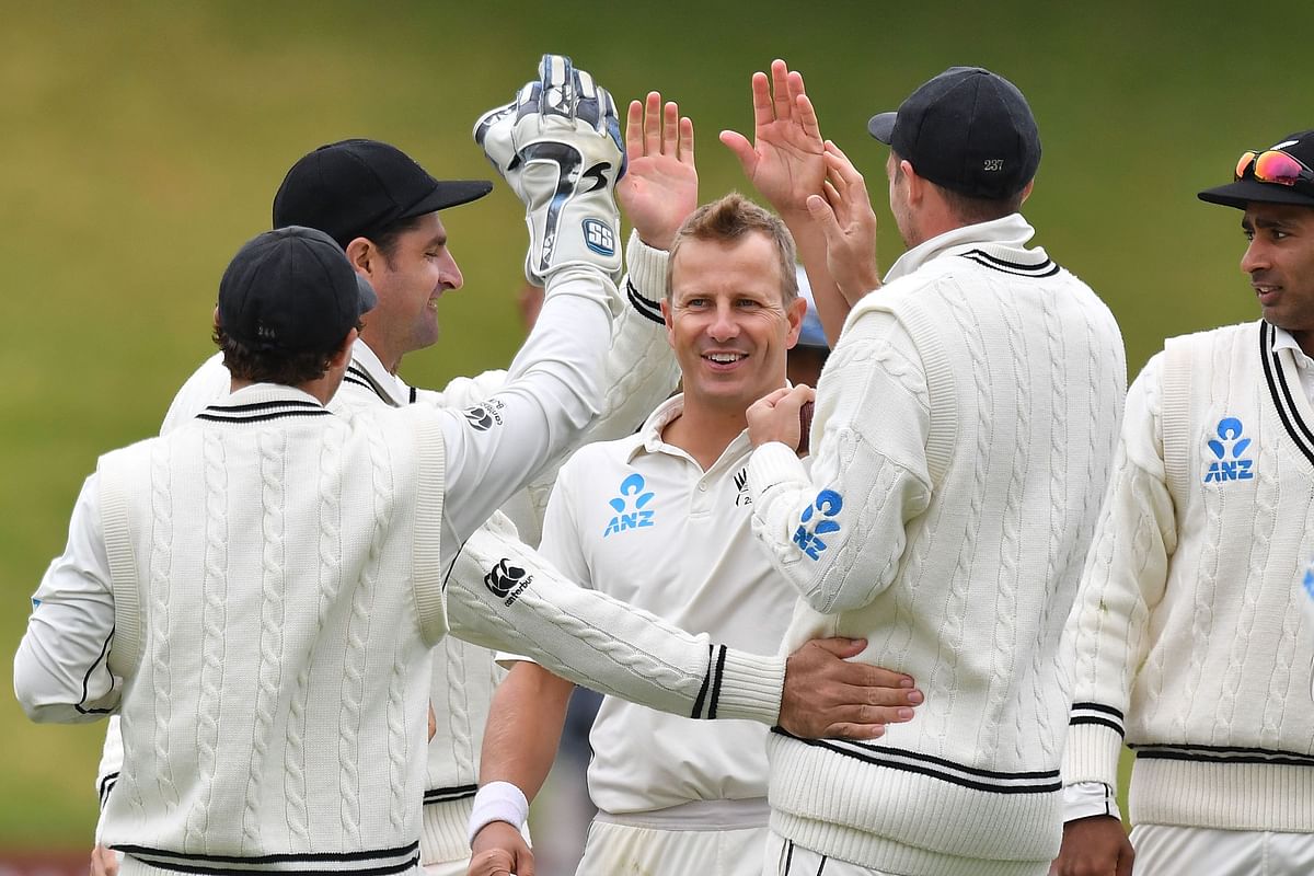 New Zealand`s Neil Wagner (C) celebrates Bangladesh`s Tamim Iqbal Khan being caught with teammates during day three of the second Test cricket match between New Zealand and Bangladesh at the Basin Reserve in Wellington on 10 March 2019. Photo: AFP