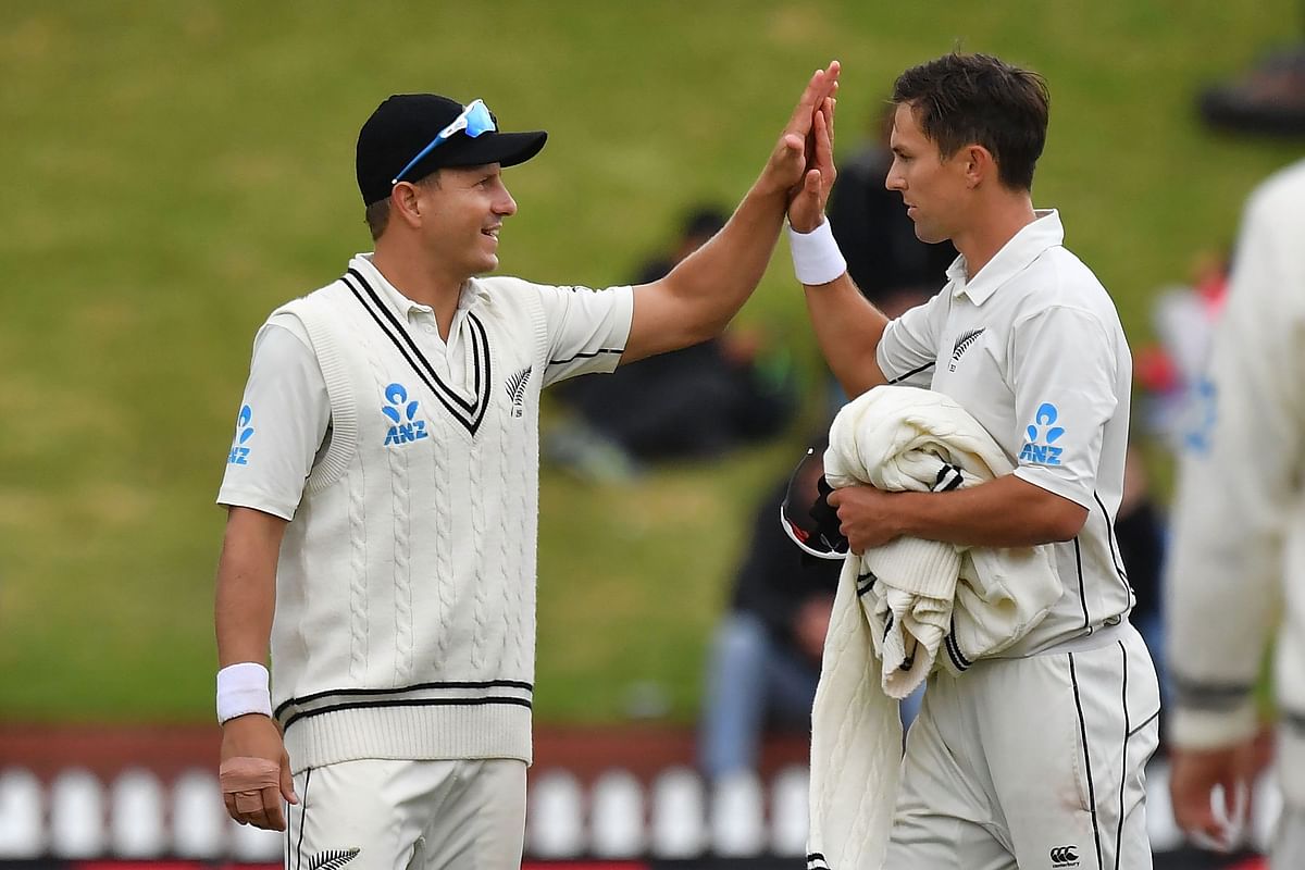 New Zealand`s Neil Wagner (L) celebrates Bangladesh`s Abu Jayed being bowled by teammate Trent Boult (R) during day three of the second Test cricket match between New Zealand and Bangladesh at the Basin Reserve in Wellington on 10 March 2019. Photo: AFP