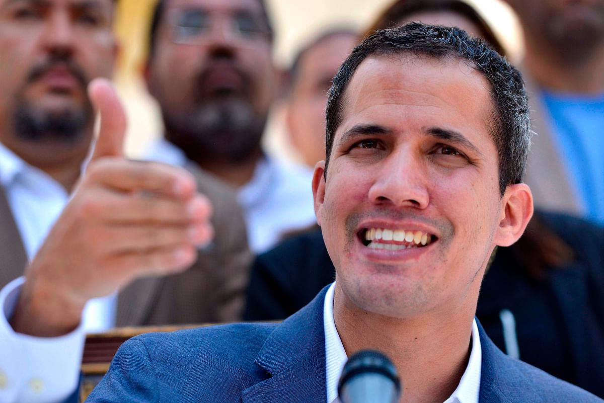 Venezuelan opposition leader and self-proclaimed acting president Juan Guaido gestures as he speaks during a press conference at the Venezuelan National Assembly in Caracas on 10 March. Photo: AFP