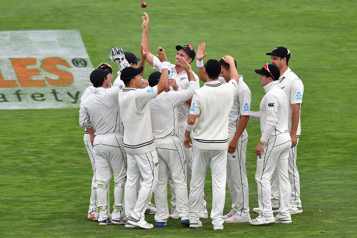 New Zealand Cap: New Zealand`s Tim Southee (C) celebrate the dismissal of Bangladesh`s Mominul Haque with teammates during day four of the second cricket Test match between New Zealand and Bangladesh at the Basin Reserve in Wellington on 11 March 2019. Photo: AFP