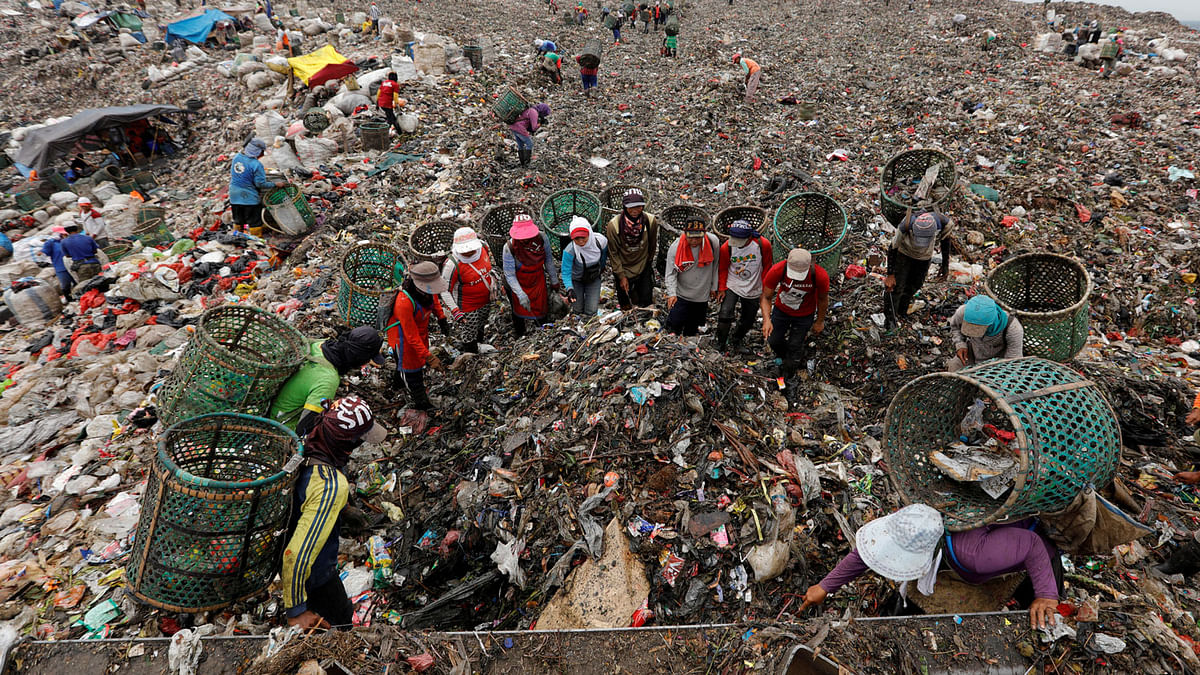 A group of scavengers search items and plastics to sell for recycling at Bantar Gebang landfill in Bekasi, West Java province, Indonesia on 2 March. Photo: Reuters