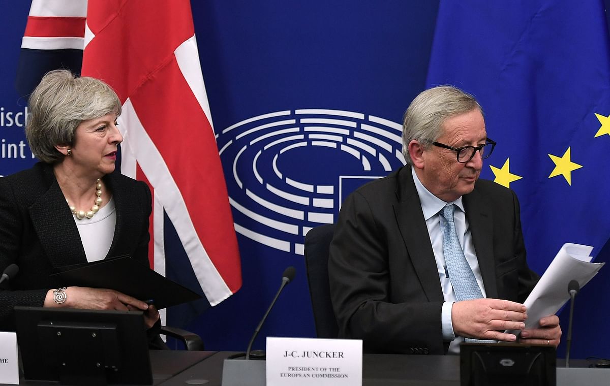 European Commission president Jean-Claude Juncker (R) and British prime minister Theresa May prepare to leave after giving a press conference following their meeting in Strasbourg, on 11 March 2019. Photo: AFP