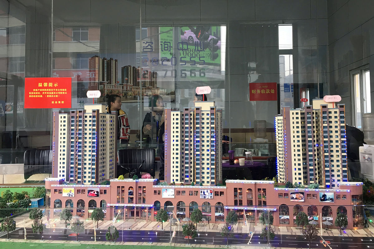 Model showing a residential and commercial compound is seen at a real estate showroom in Yanan. Photo: Reuters