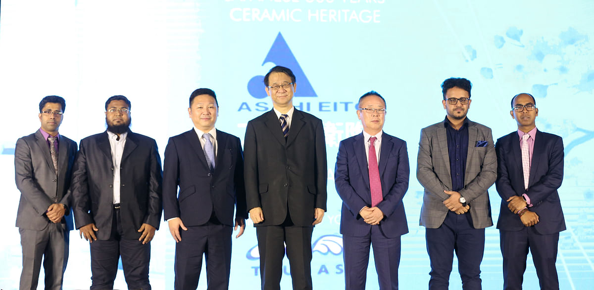 Guests and officials of Japanese ceramic manufacturing company `Asahi Eito` pose for photograph at the opening ceremony of its journey in Bangladesh at a city hotel on Monday. Photo: Collected