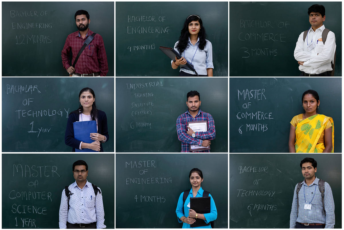 A combo shows unemployed people posing in front of a chalkboard with their qualifications during a job fair in Chinchwad. Photo: Reuters