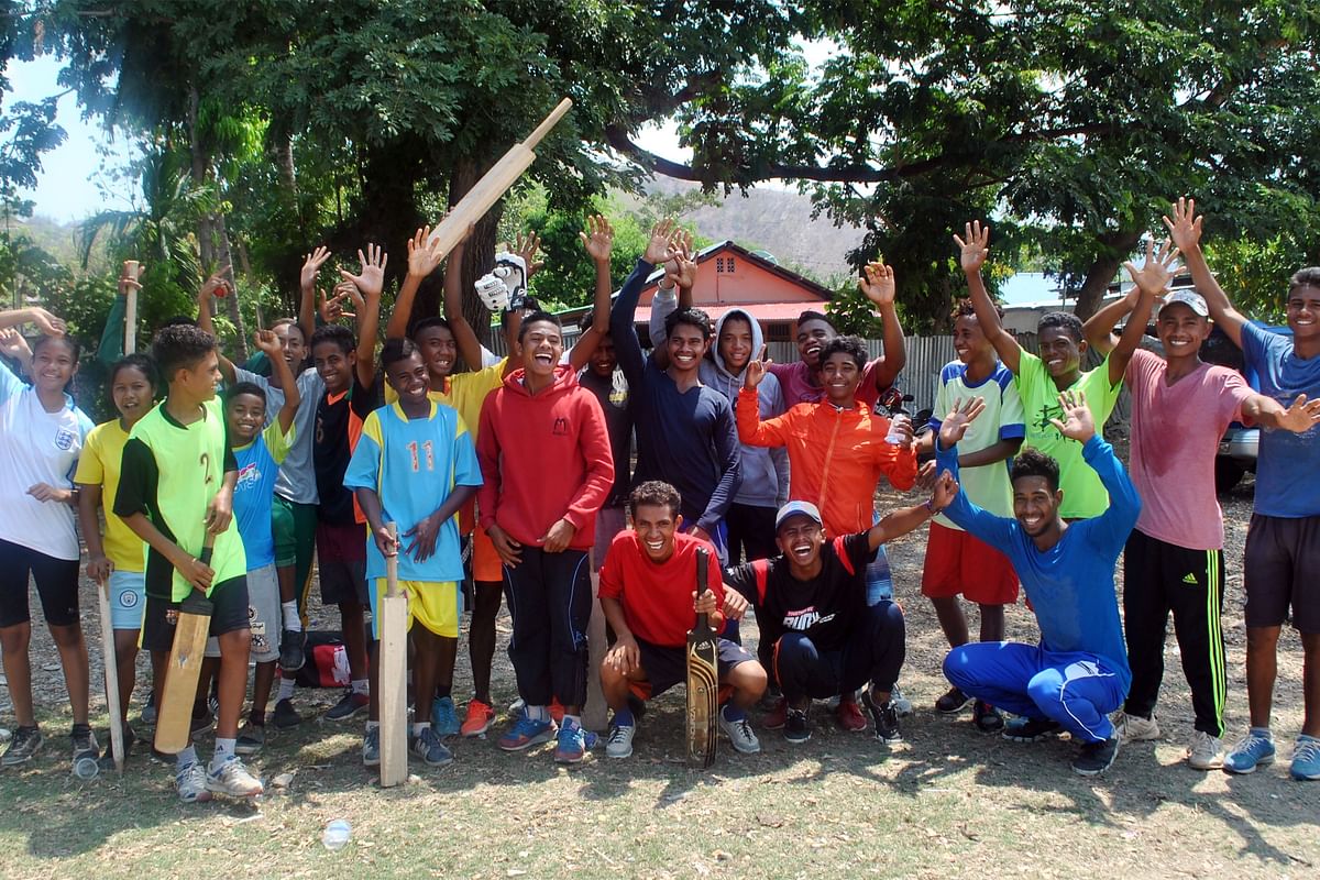 This undated handout picture released on 11 March 2019 by the Timor Leste Cricket Association shows local youth attending a cricket match in Dili, the capital of East Timor. Photo: AFP