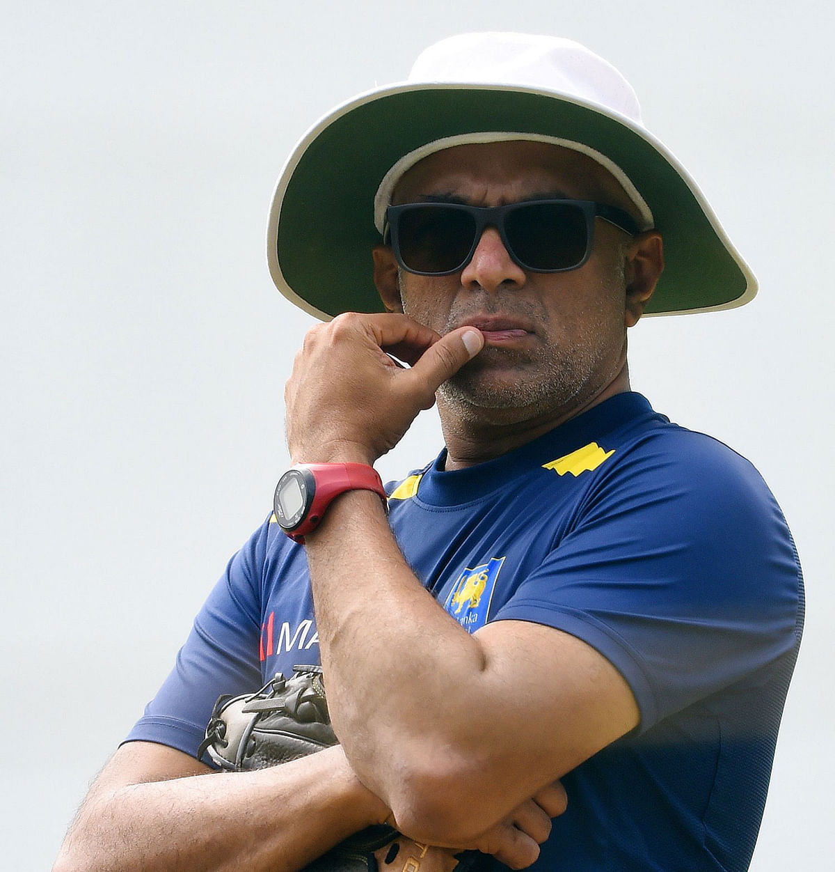 In this file photo taken on 13 November, 2018, Sri Lanka`s coach Chandika Hathurusingha looks on during a practice session at the Pallekele International Cricket Stadium in Kandy. Photo: AFP