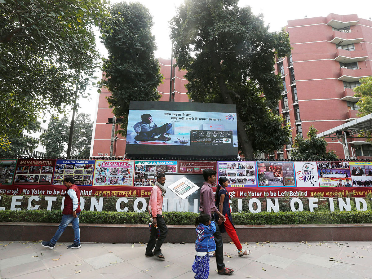 People walk past the Election Commission of India office building in New Delhi, India on 11 March 2019. Photo: Reuters