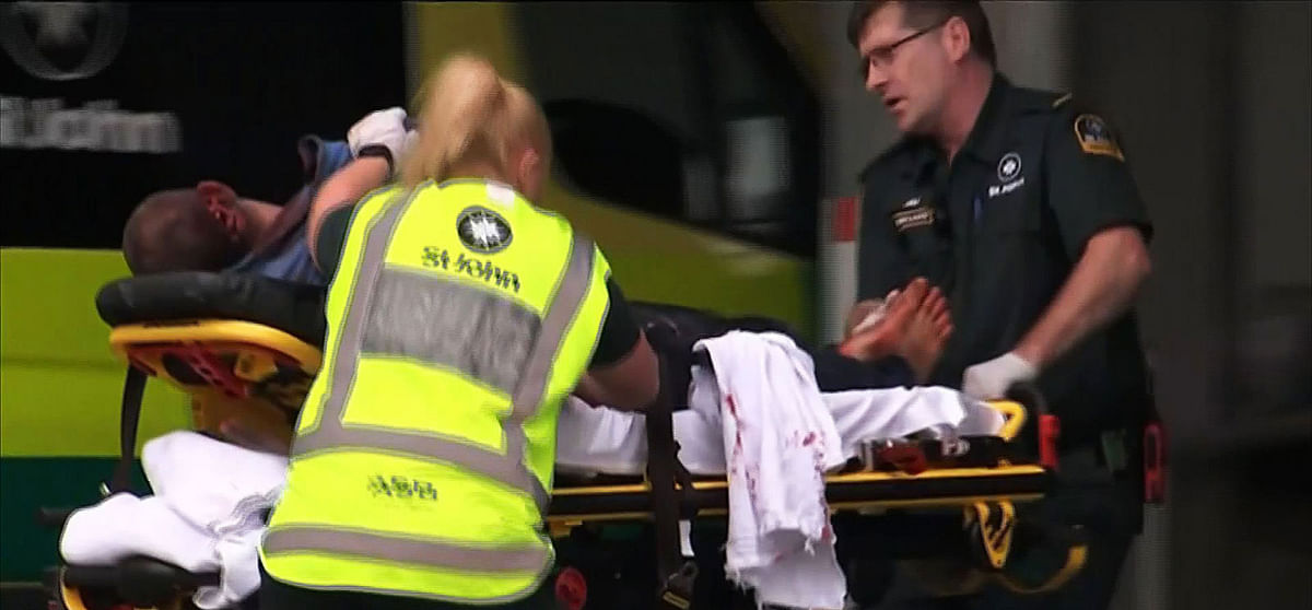 An image grab from TV New Zealand taken on 15 March 2019 shows a victim arriving at a hospital following the mosque shooting in Christchurch. Photo: AFP
