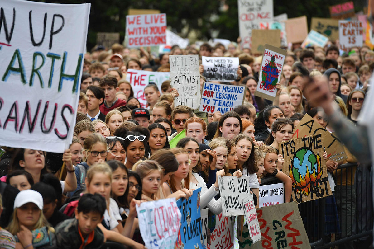 Thousands of school children march through the CBD on their way to Parliament during a strike and protest by students highlighting inadequate progress to address climate change in Wellington on 15 March 2019. Photo: AFP