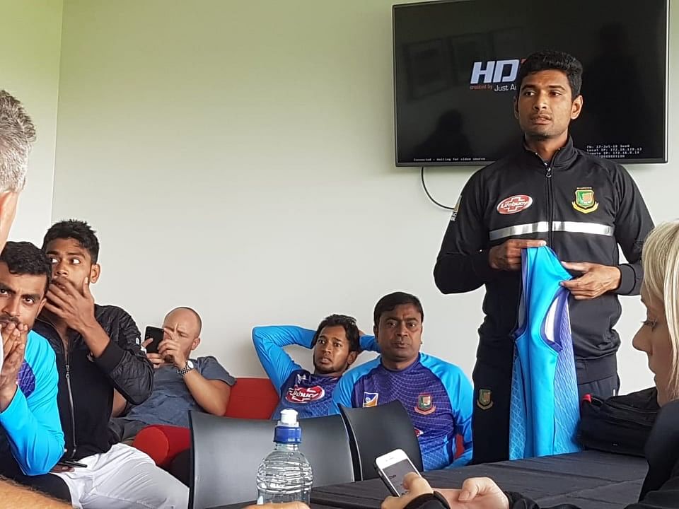 Concerned cricketers wait in changing room of the Oval grounds. Photo: Prothom Alo