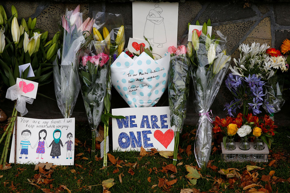 Flowers and signs are seen at a memorial as tributes to victims of the mosque attacks near Linwood mosque in Christchurch, New Zealand, on 16 March 2019. Photo: Reuters