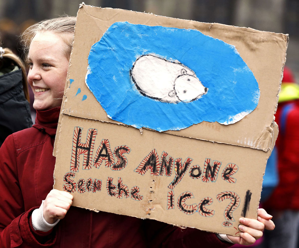 A student demonstrates in Amsterdam against climate change, on 14 March. Photo: AFP