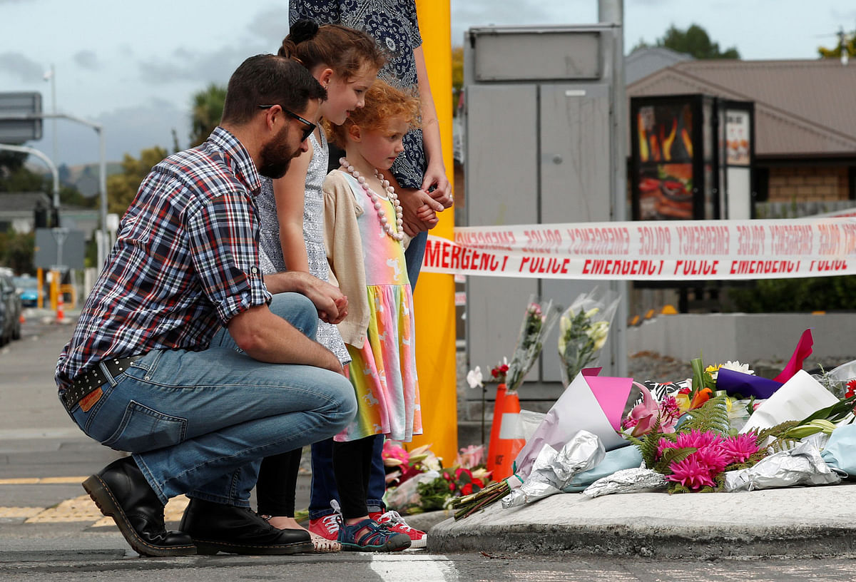 People react after placing flowers at a memorial as a tribute to victims of the mosque attacks, near a police line outside Masjid Al Noor in Christchurch, New Zealand, on 16 March 2019. Photo: Reuters