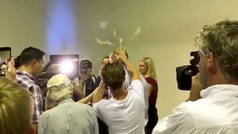 Australian senator Anning had an egg smashed on his head while talking to the media in Victoria, Australia. Photo: Reuters