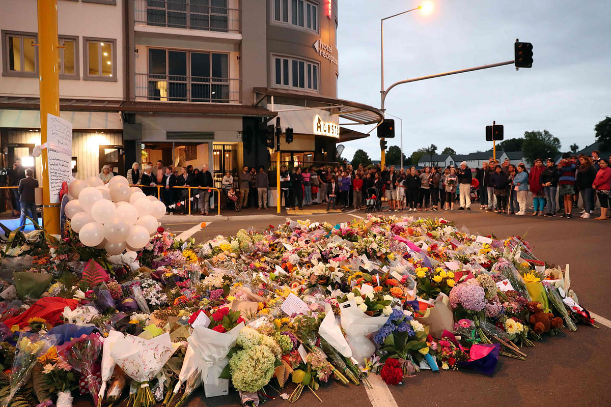 Tributes are seen as mourners pay their respects for victims of the 15 March mosque attacks, in Christchurch on 16 March 2019. Photo: AFP