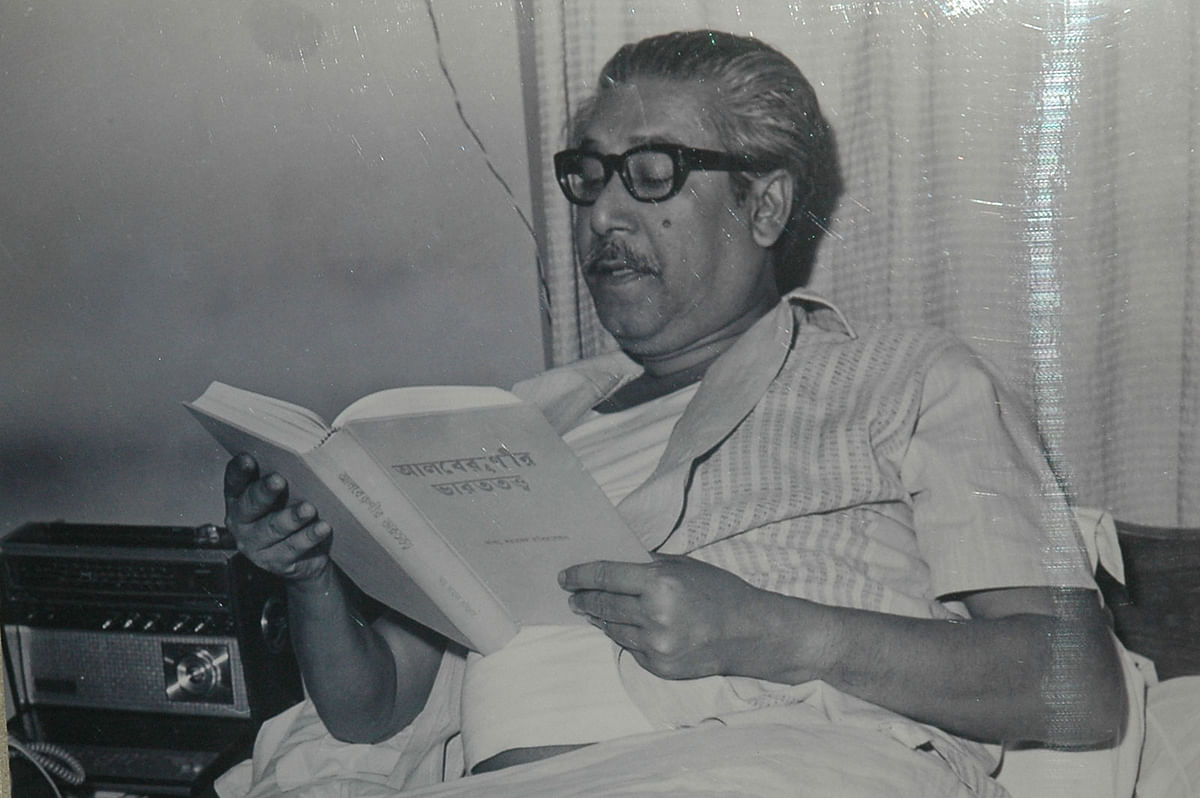 Sheikh Mujibur Rahman reading a Bangla translation of Al Beruni’s book on India. File Photo