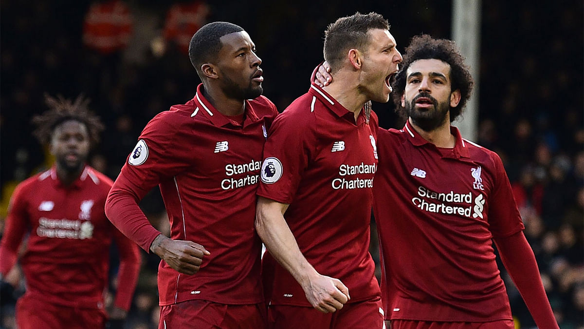 Liverpool`s English midfielder James Milner (C) celebrates scoring the team`s second goal during the English Premier League football match between Fulham and Liverpool at Craven Cottage in London on 17 March, 2019. Photo: AFP