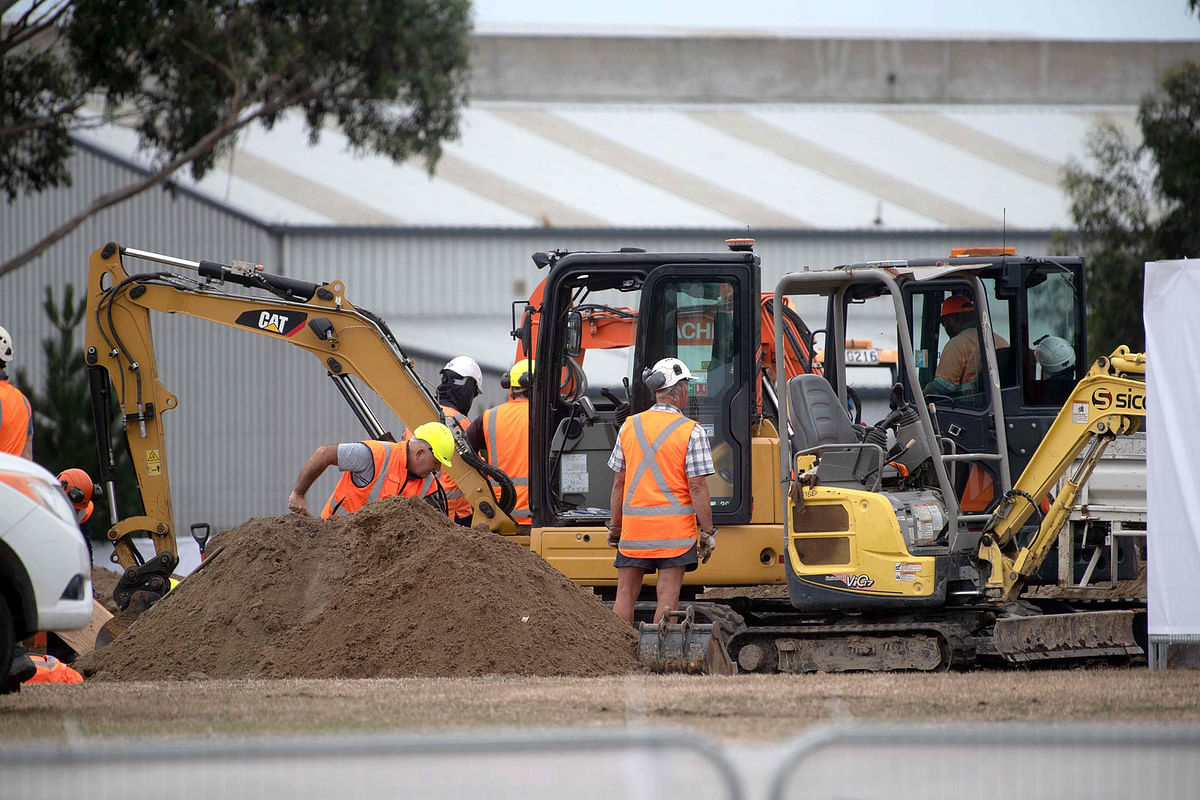 Workers dig grave sites at a cemetery in Christchurch on 17 March 2019 two days after a shooting incident at two mosques in the city. Photo: AFP
