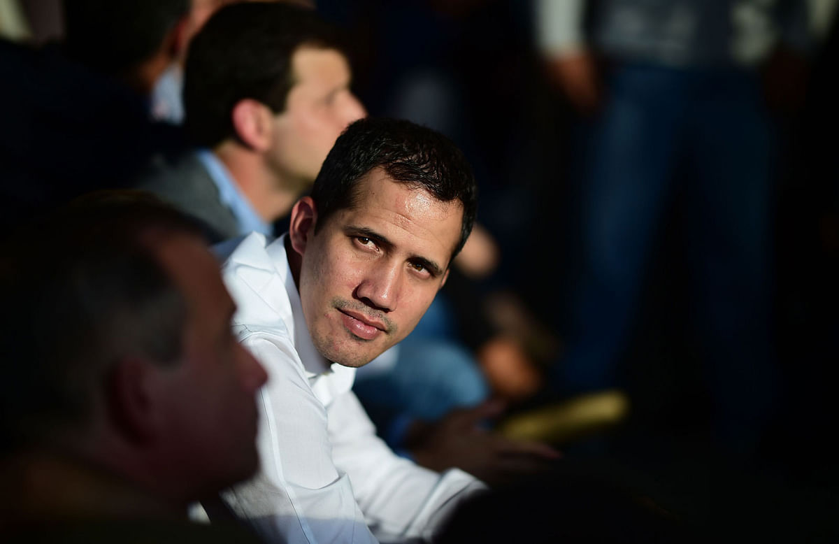 Venezuelan opposition leader and self-proclaimed interim president Juan Guaido attends a meeting with local leaders in Caracas, on 14 March. AFP File Photo