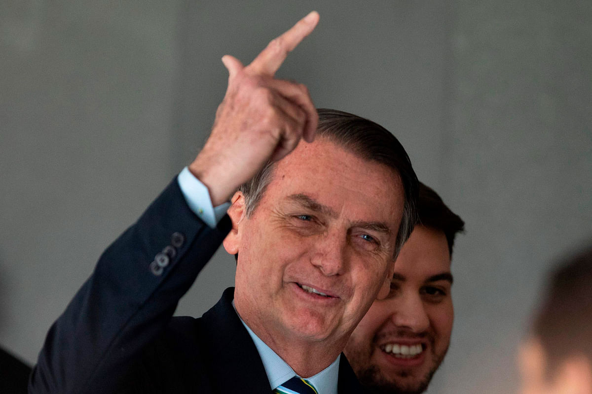 In this file photo taken on 12 March Brazil`s president Jair Bolsonaro gestures after receiving Paraguay`s president Mario Abdo Benitez (out of frame) at Planalto palace in Brasilia. Photo: AFP