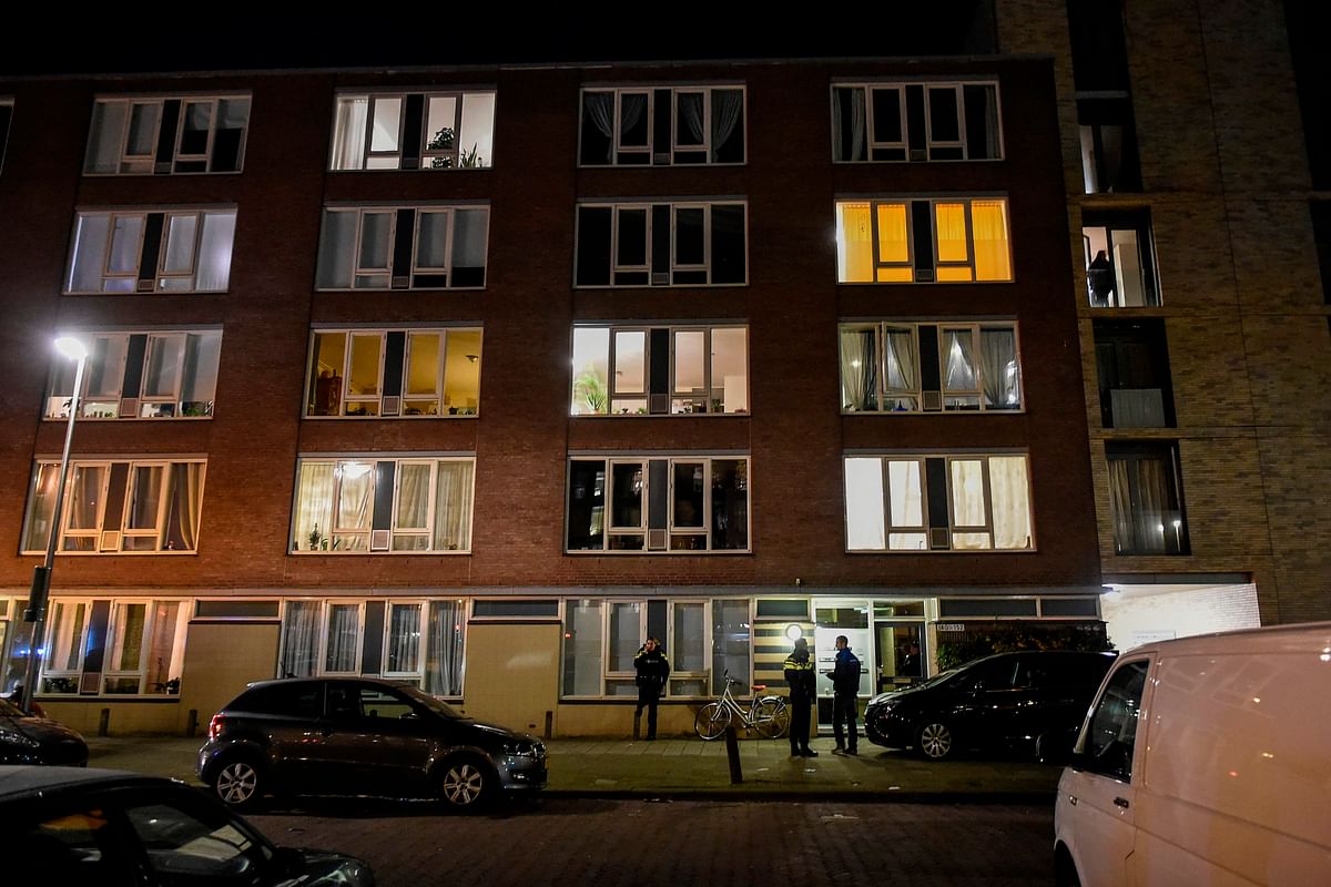 A picture taken on 18 March, 2019 shows a building in the Oudenoord neighbourhood of Utrecht, where Dutch police officers conduct an investigation following a shooting on a tram that left three people dead and several wounded. Photo: AFP
