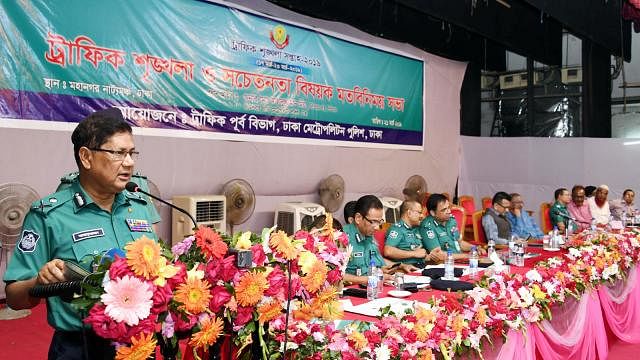Dhaka Metropolitan Police (DMP) commissioner Asaduzzaman Mia addresses a programme on traffic discipline and awareness at Mohanagar Natya Mancha on Thursday. Photo: DMP