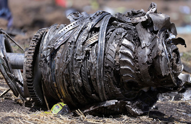 irplane engine parts are seen at the scene of the Ethiopian Airlines Flight ET 302 plane crash, near the town of Bishoftu. Photo: Reuters