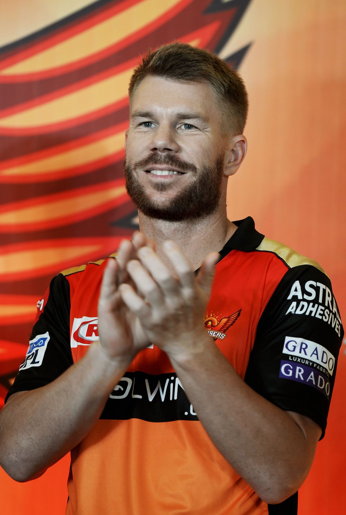 In this file photo taken on 20 March 2019, Sunrisers Hyderabad cricketer David Warner applauds during a press conference in Hyderabad ahead of the start of the 2019 Indian Premier League (IPL) cricket tournament. Photo: AFP