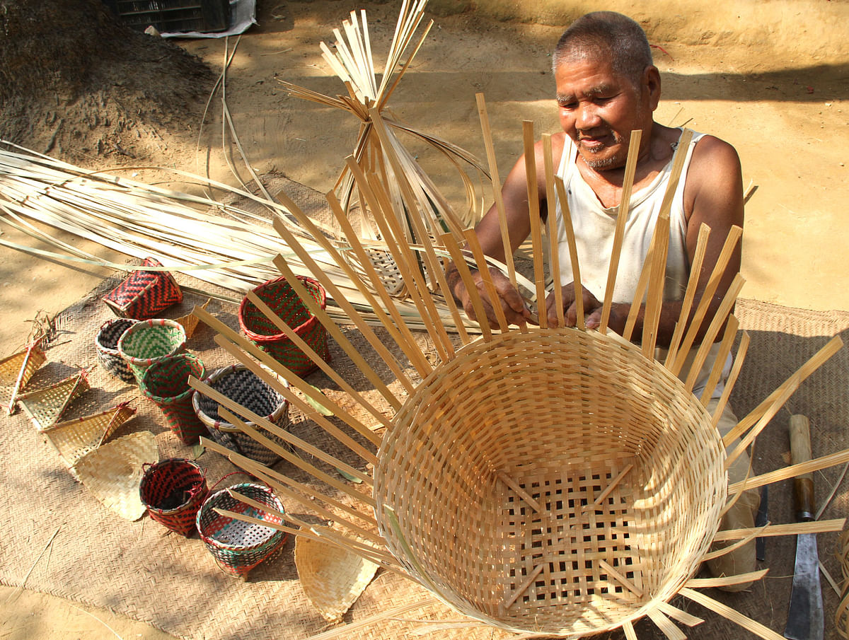 A craftsman prepares colorful baskets from bamboo and Cane at Uttar Katachari area of Rangamati on 23 March. Photo: Supriya Chakma