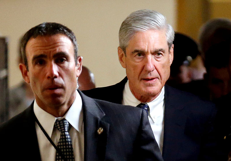 Special counsel Robert Mueller (R) departs after briefing members of the US senate on his investigation into potential collusion between Russia and the Trump campaign on Capitol Hill in Washington, US on 21 June 2017. Reuters File Photo