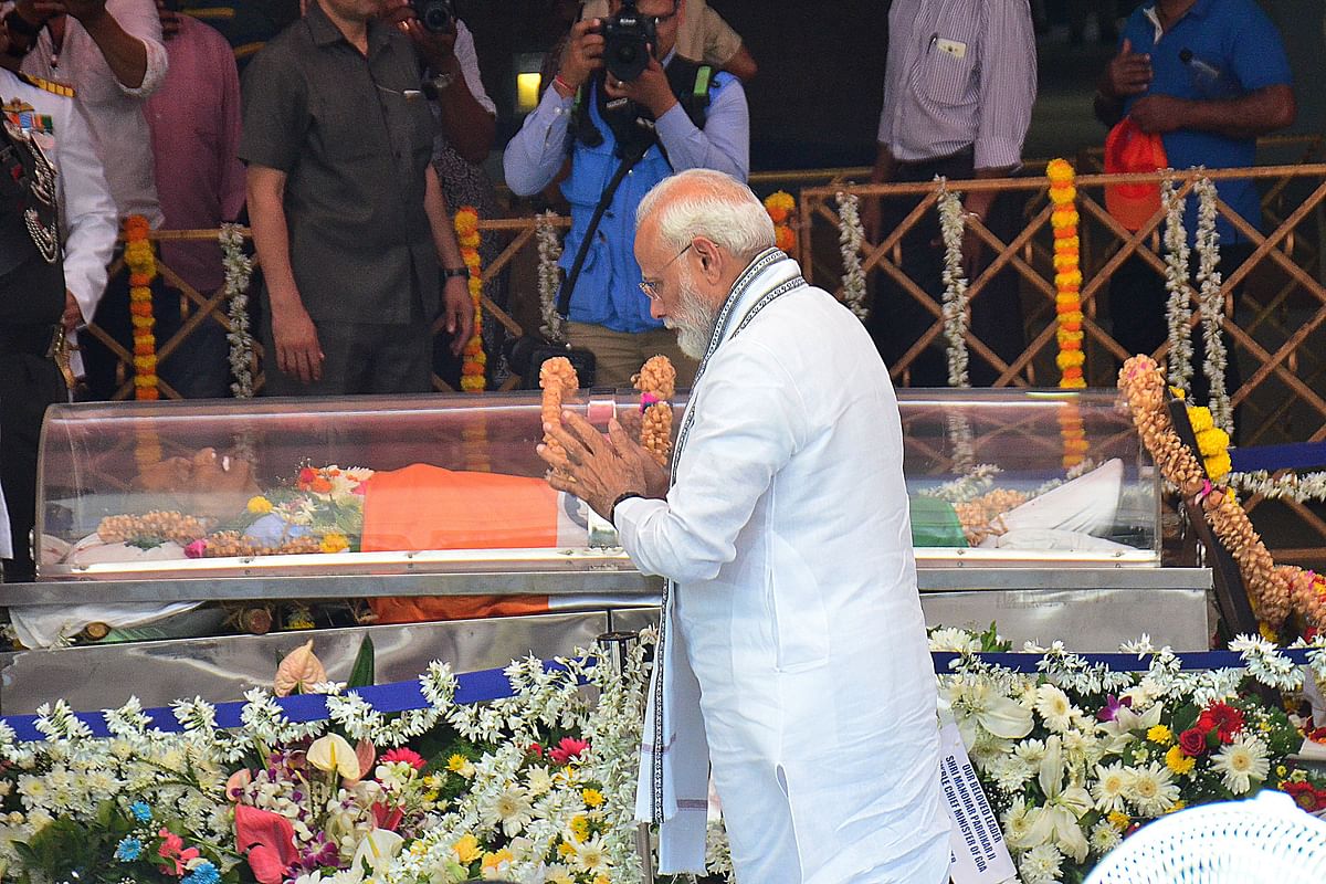 Indian prime minister Narendra Modi pays his respects in front of the body of former chief minister of Goa and former defence minister Manohar Parrikar during his funeral in Panaji on 19 March 2019. Photo: AFP