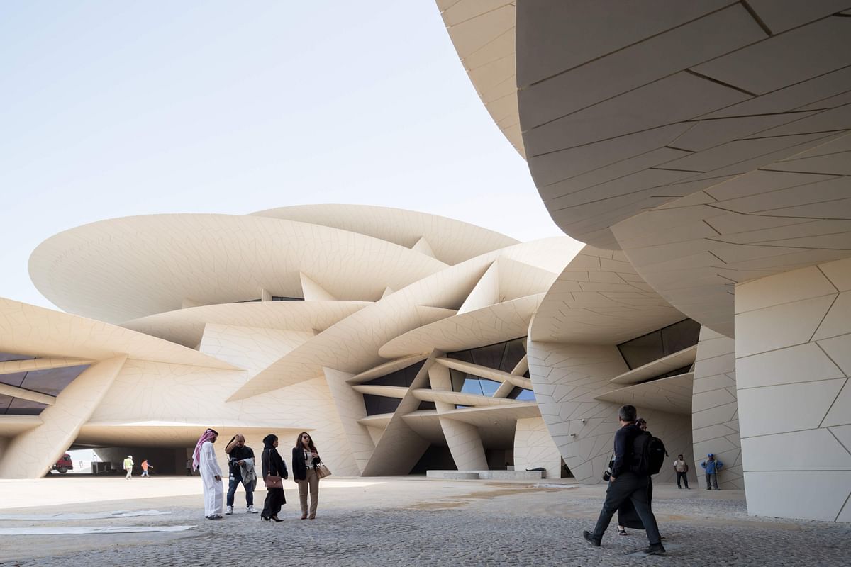 This handout picture provided by the National Museum of Qatar on 16 February, 2019 shows visitors in front of the museum building designed by French architect Jean Nouvel. Photo: AFP