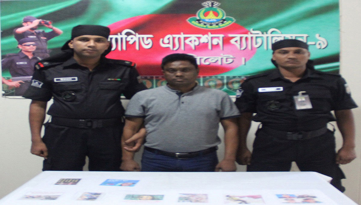 Rapid Action Battalion (RAB) members detained a young man from Ghasitula Baramasjid area of Sylhet city early Tuesday for reportedly making derogatory comments on prime minister Sheikh Hasina, her son Sajeeb Wazed Joy and ministers and MPs on his Facebook wall. Photo: UNB