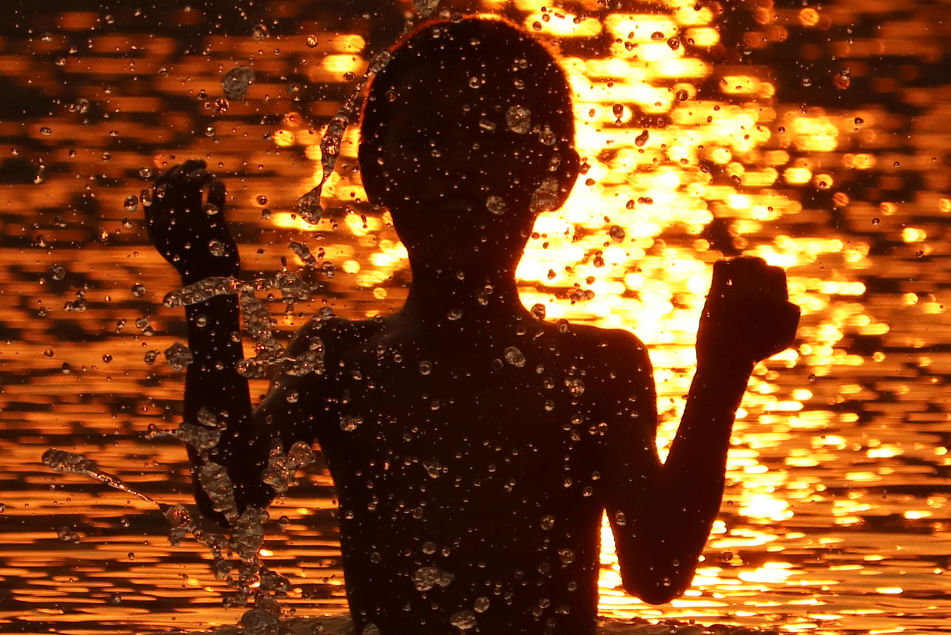 A child bathing in the river Chengi at Battali, Khagrachhari on 24 March 2019. Photo: Nerob Chowdhury