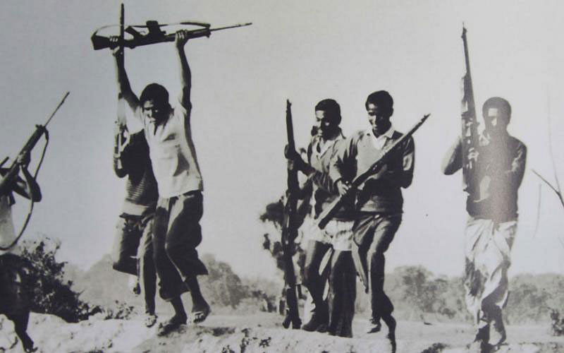 Freedom fighters are seen celebrating victory over the Pakistan arm on 16 December, 1971, the day Bangladesh emerged as independent, sovereign country. Photo: Omiyo Tarafder (collected from the book `Ekattor-Bijayer Shei Khon` by CM Tareque Reza).