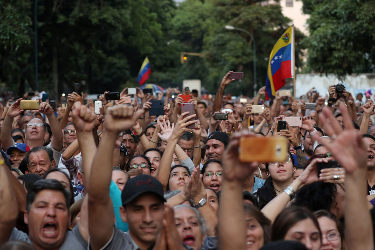 Supporters cheer during a meeting with Venezuelan opposition leader Juan Guaido, who many nations have recognised as the country`s rightful interim ruler, in Caracas, Venezuela, on 28 March 2019. Photo: Reuters