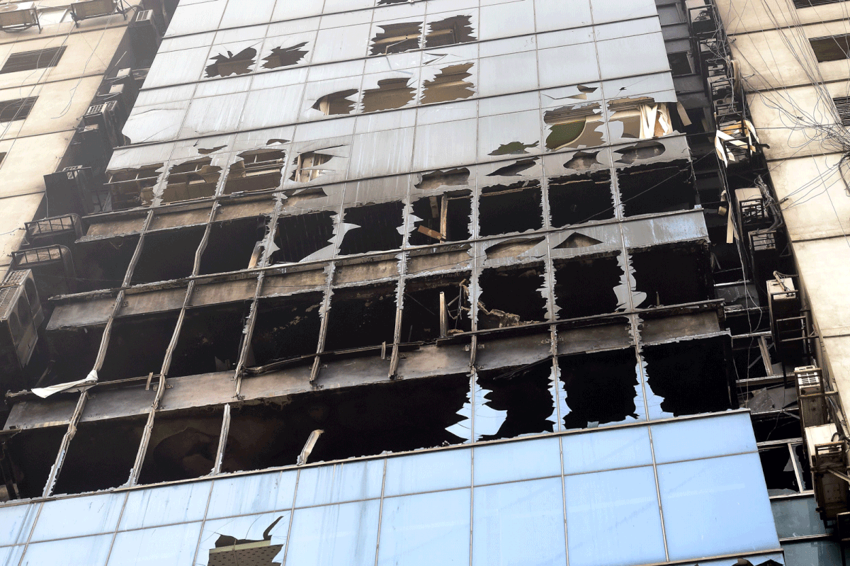 Wreckage of the burnt building is seen in Dhaka on 29 March 2019, a day after flames tore through the 22-storey FR Tower. Photo: AFP