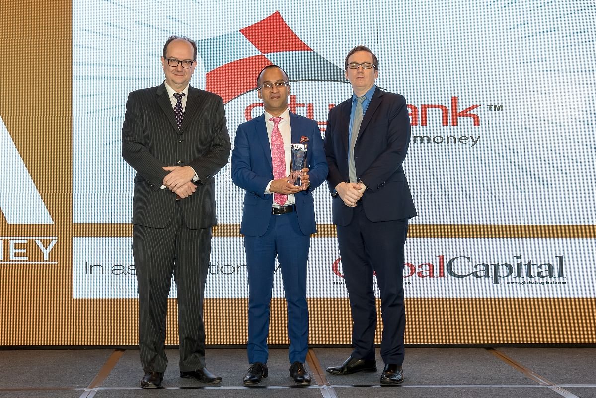 City Bank MD and CEO Mashrur Arefin (centre) holds the Asiamoney ‘Best Bank for Premium Services’ award at a ceremony in Hong Kong