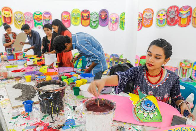 Dhaka University`s Faculty of Fine Arts (FFA) students busy painting murals to celebrate upcoming Pahela Baishakh, first day of Bangla New Year, on DU campus on 31 March, 2019. Photo: Dipu Malakar