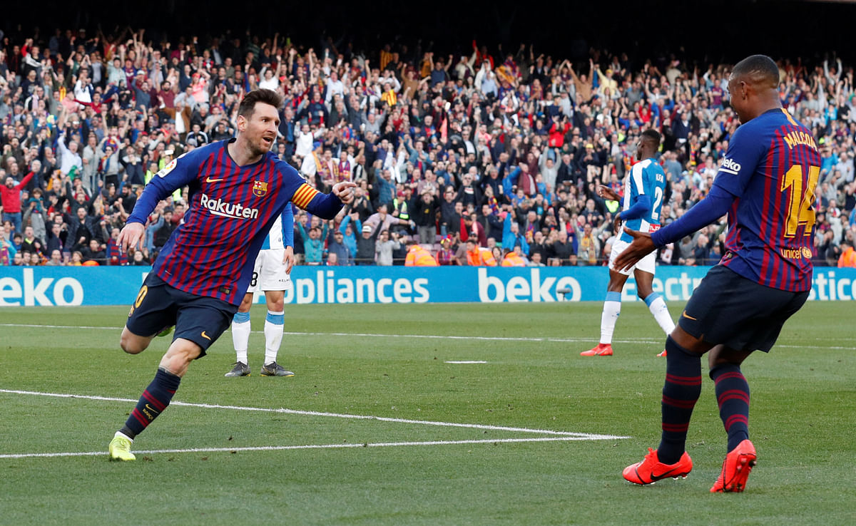 Barcelona`s Lionel Messi celebrates scoring their second goal with Malcom in a La Liga match against Espanyol at Camp Nou, Barcelona, Spain on 30 March 2019. Photo: Reuters